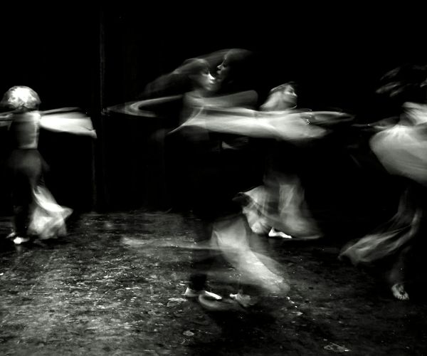 Dynamic violet light arcs showing energy and movement